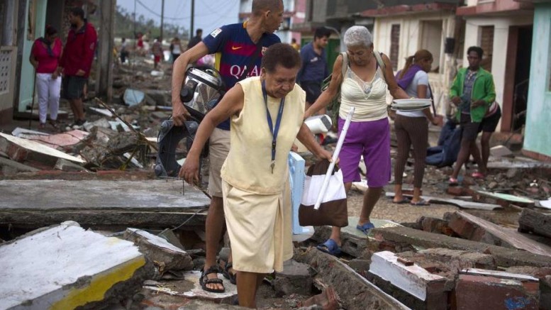 Residents of Baracoa reconvene after evacuations to rebuild after Matthew. Photo (c) Ramon Espinosa AP
