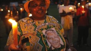 A women mourns Madiba's death. Photo (c) BBC 2013
