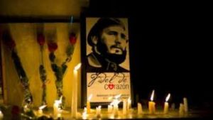 Candles are placed around Fidel's image. Photo (c) BBC 2016