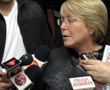 Bachelet talks to journalists after a meeting at the National Emergency Bureau Ministry of the Interior in Santiago de Chile
