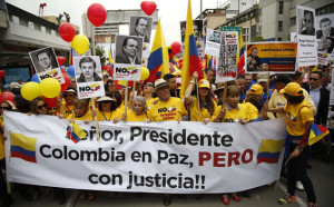 Opponents of the peace deal march through the streets. Photo (c) The Daily Mail//Fernando Vergara